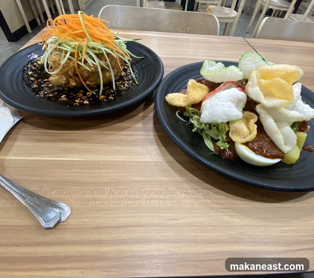 Two plates of food on a wooden table