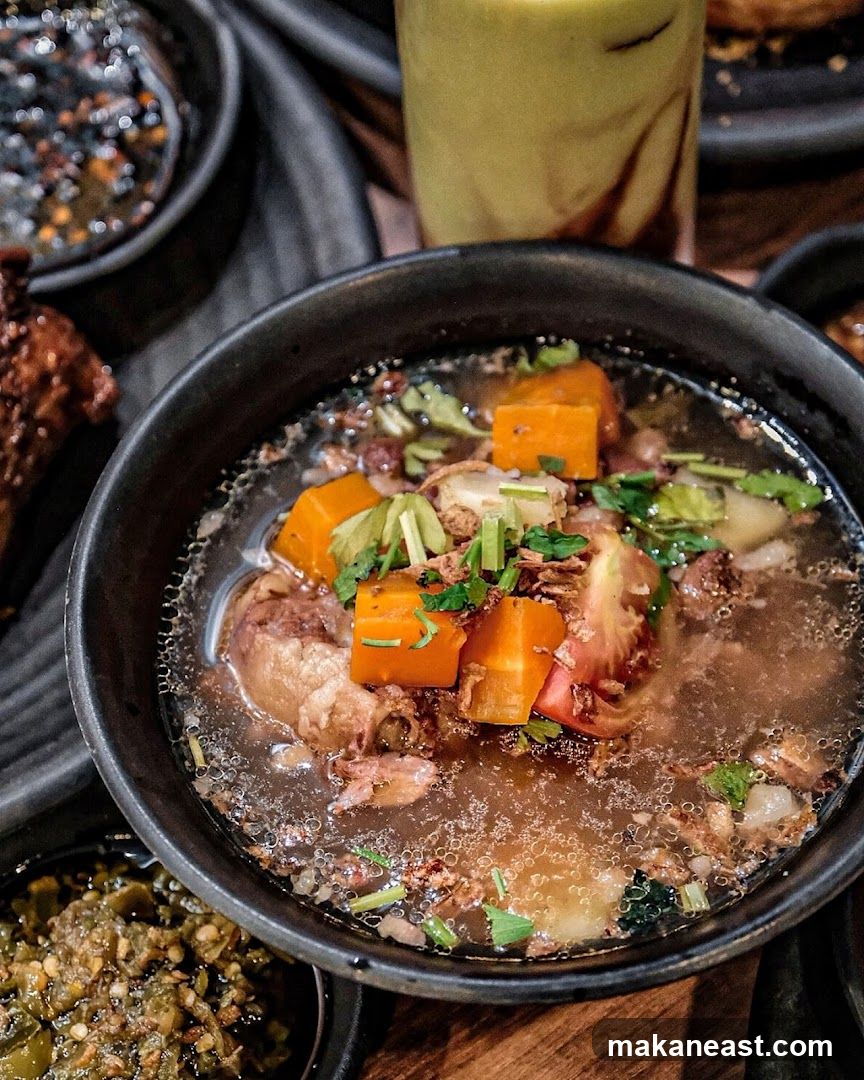 Bowl of Soup with Vegetables and Meat