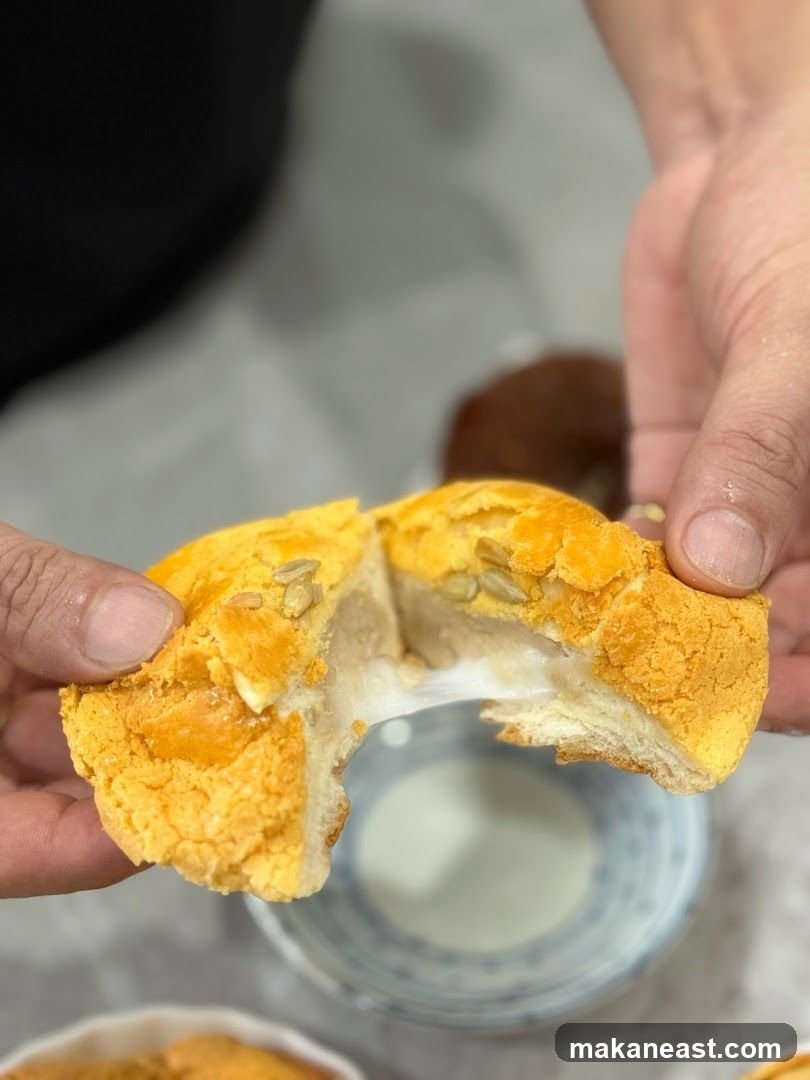 Close-up of a sweet bun being pulled apart