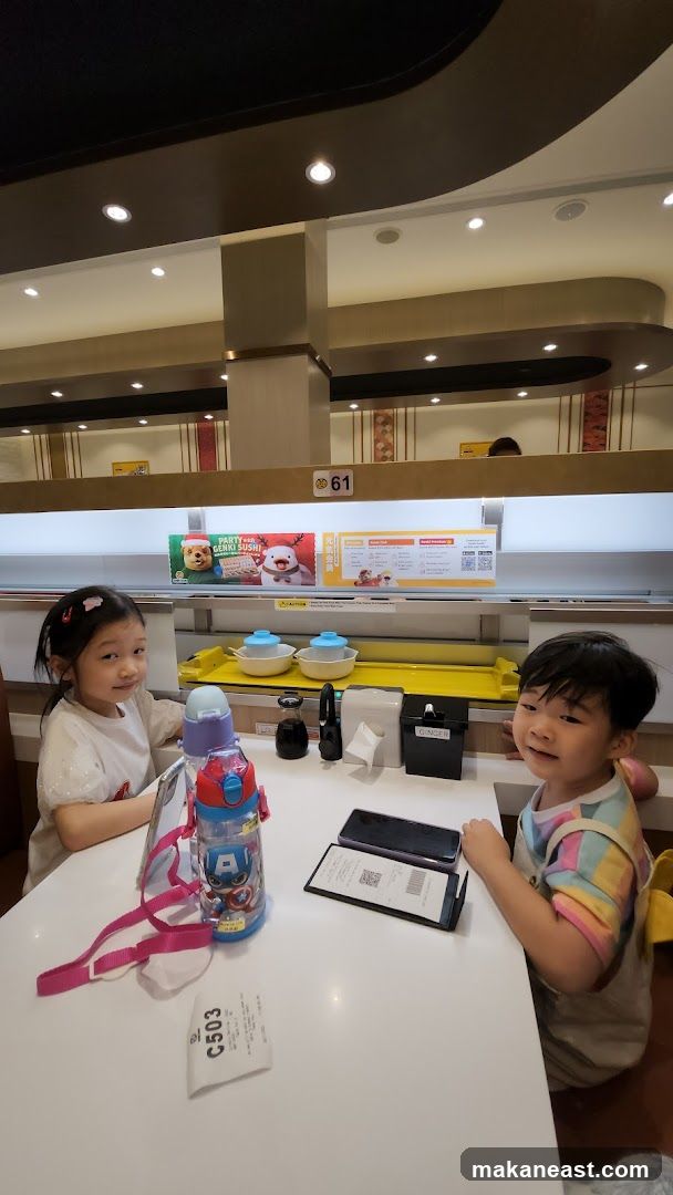 Children at a Sushi Restaurant