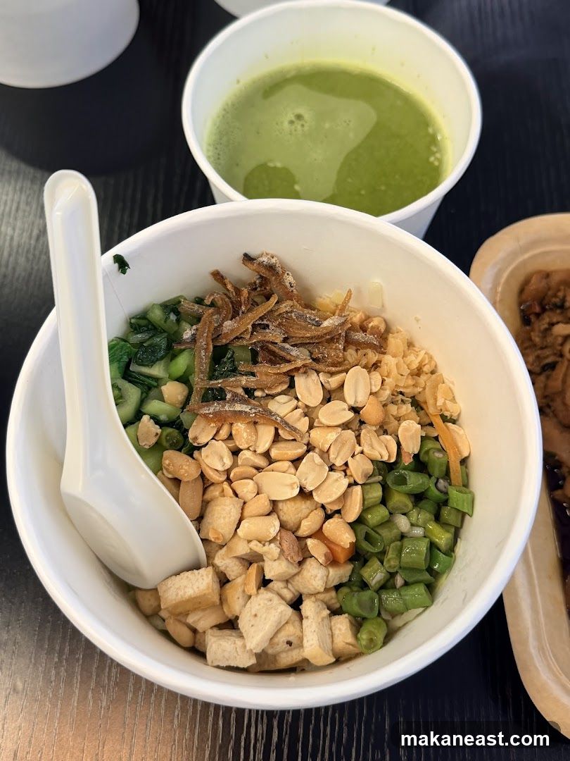 Rice bowl with toppings and a drink