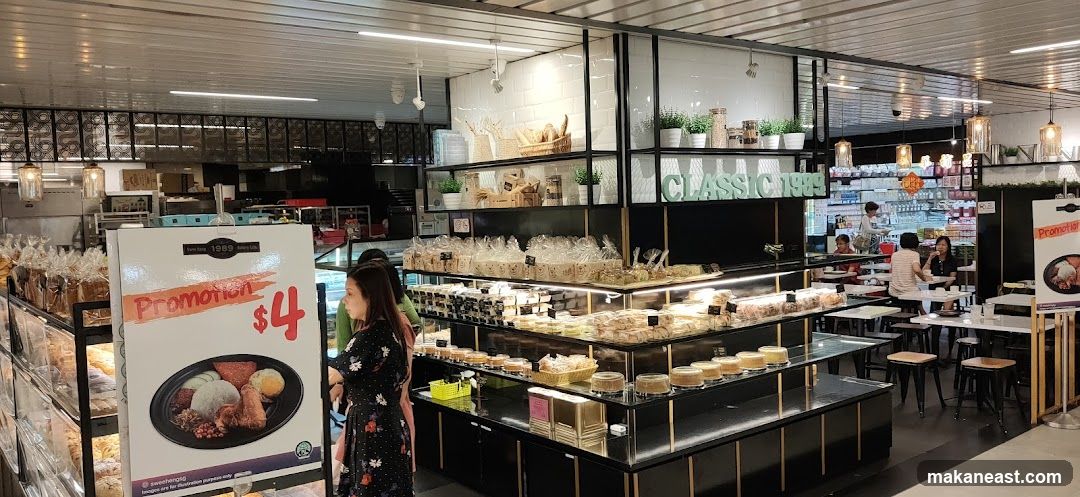 Bakery interior with promotions and seating