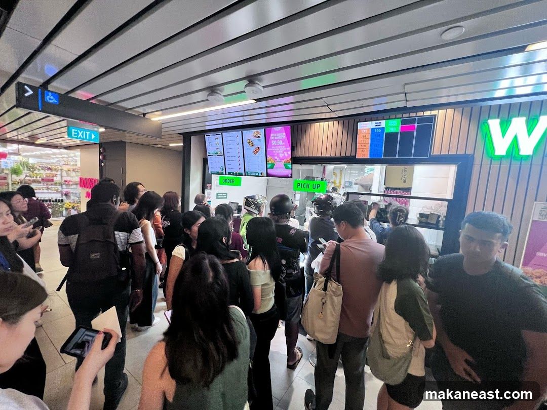 People Waiting in Line at a Food Establishment