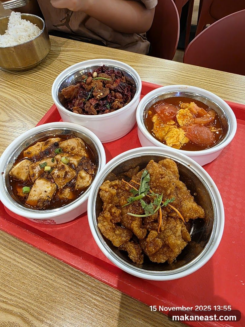 Four bowls of food on a red tray