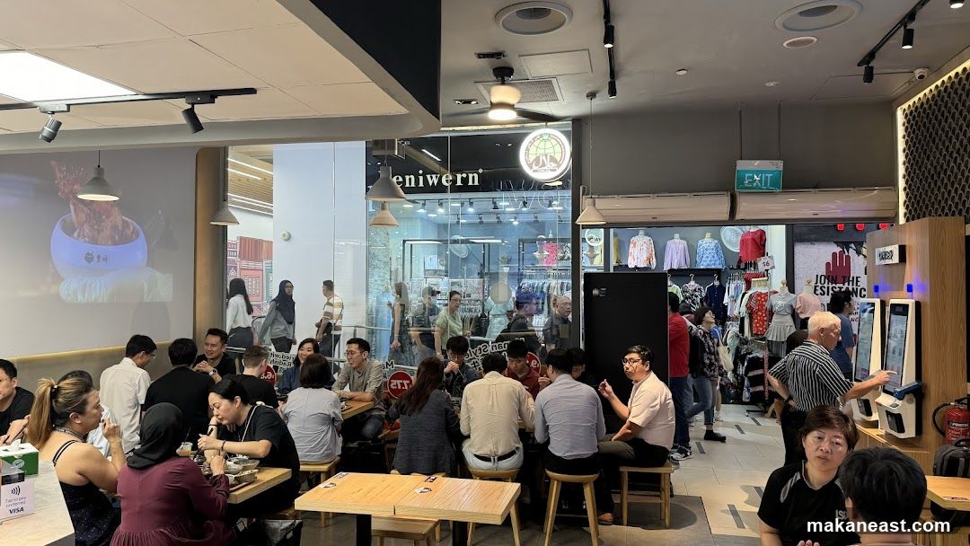 Diners at tables in a restaurant