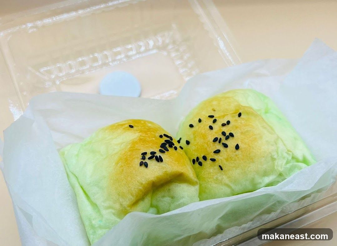 Two Green Buns with Sesame Seeds