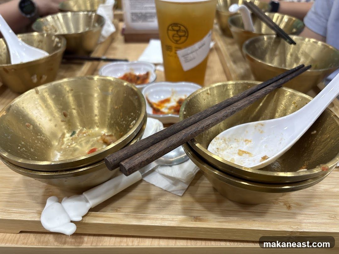 Table with Used Bowls and Drink