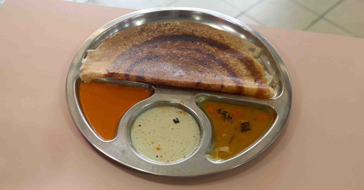 A crispy cereal thosai served with coconut chutney, masala chutney and dhal at Rajarani Thosai, the Michelin-listed stall at Tampines Round Market