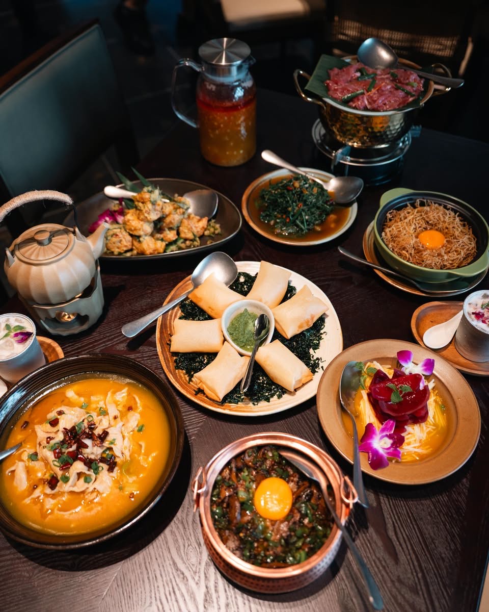 Shan Li You Yunnan dishes on a table at Jewel Changi including soup, spring rolls and claypot rice
